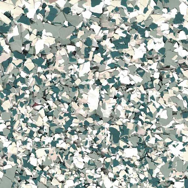 This image shows a close-up of a textured surface with irregular, multicolored fragments in shades of green, beige, and white, resembling terrazzo.