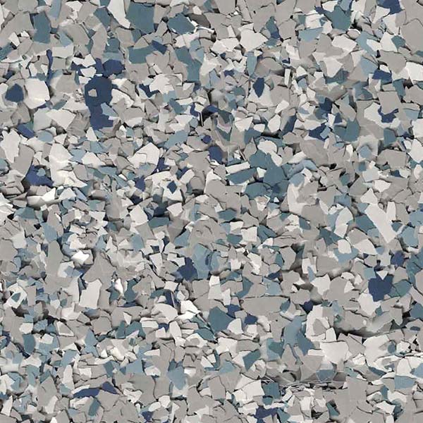 A close-up image shows a textured surface with scattered pieces of various shades of grey and blue, resembling flakes or paint chips.