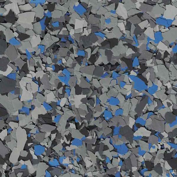 The image shows a close-up view of a textured surface with a mosaic-like pattern featuring shades of gray and blue fragments.